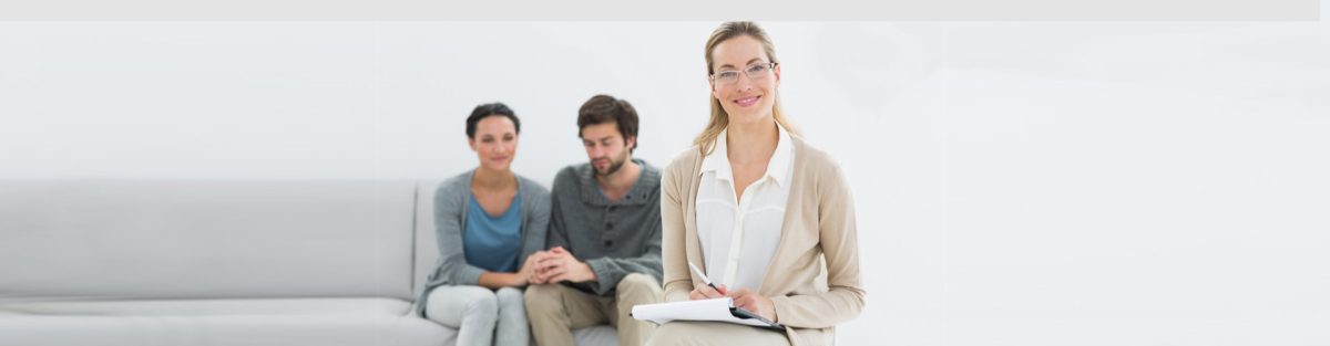 a woman smiling while holding her clipboard and a couple behind her holding hands